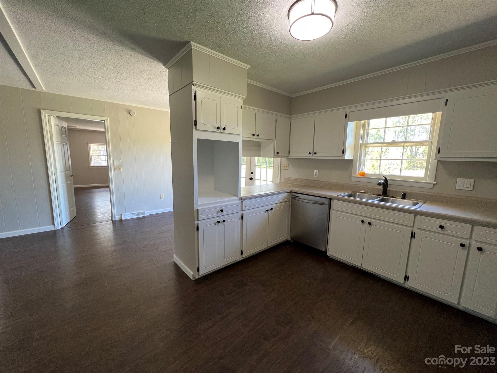 590 Hog Pen Branch Road Mooresboro, NC 28114 - Photo 10 of 36 a kitchen with granite countertop a sink cabinets and wooden floor