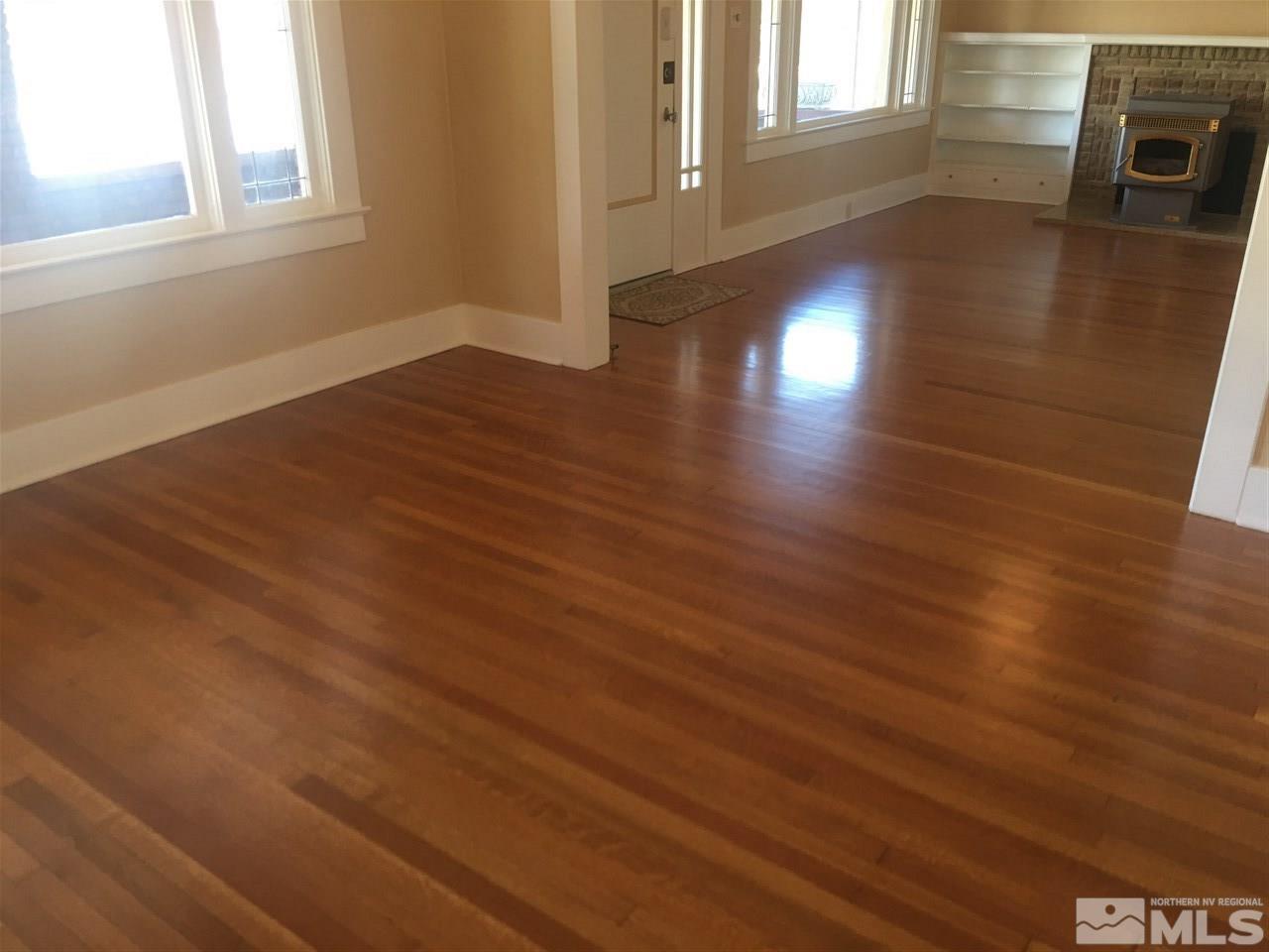 911 F Street Sparks, NV 89431 - Photo 3 of 15 an empty room with wooden floor and fire place