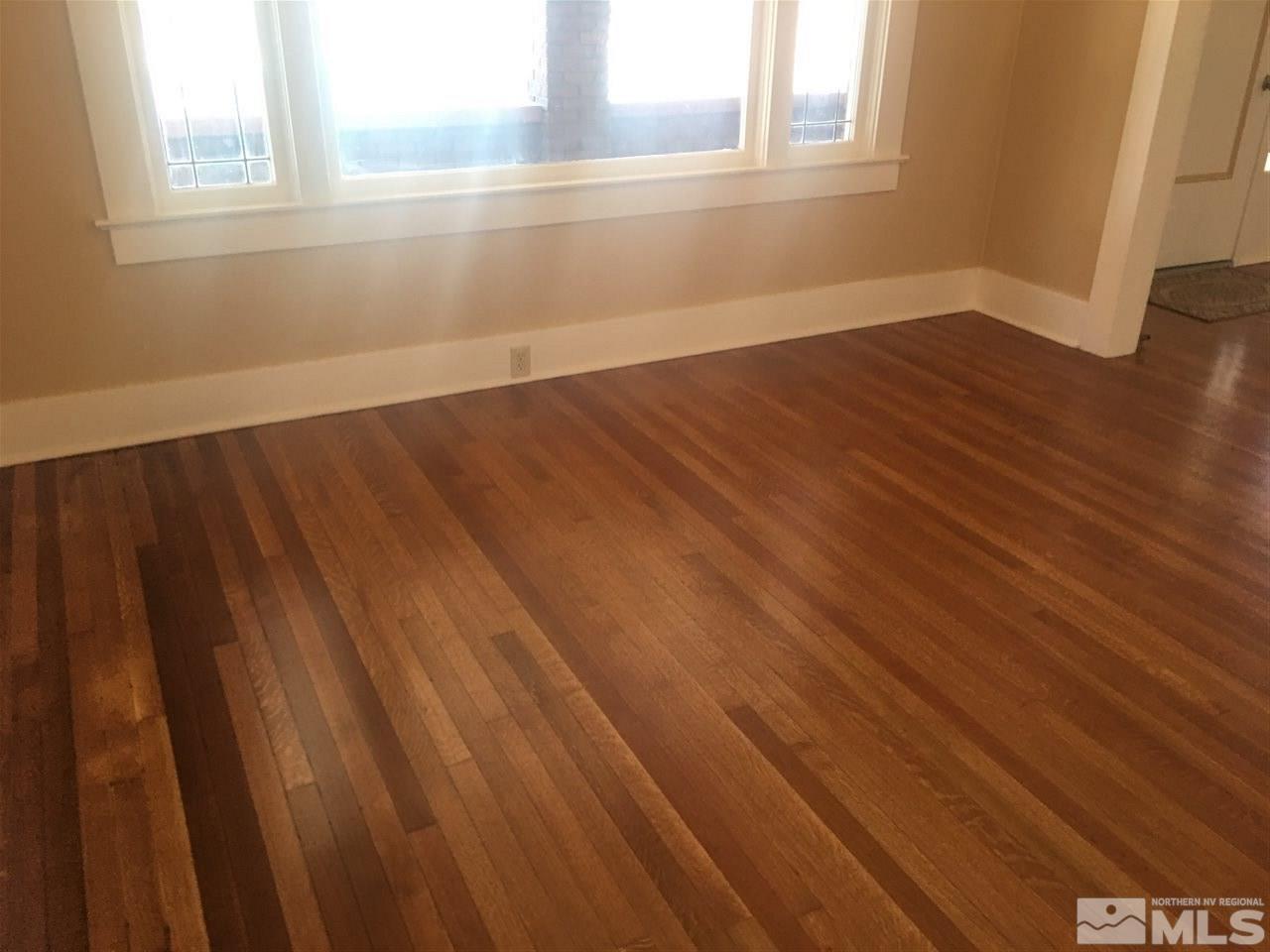 911 F Street Sparks, NV 89431 - Photo 5 of 15 a view of an empty room with wooden floor and a window