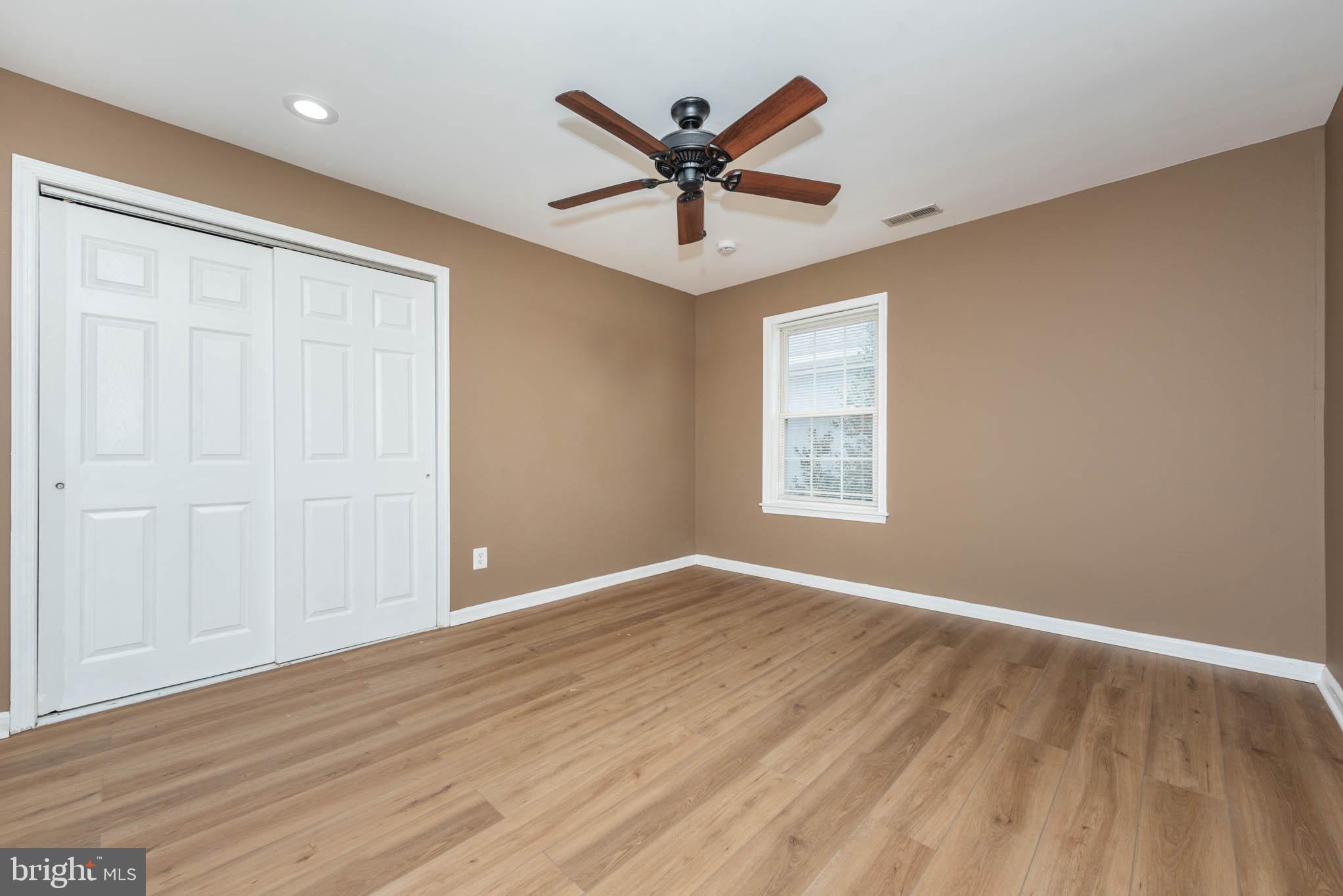 4021 Barrington Road Baltimore, MD 21207 - Photo 20 of 50 wooden floor in a room with a ceiling fan