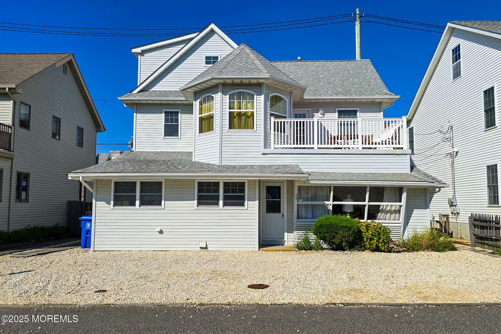 34 South Surf Road Lavallette, NJ 08735 - Photo 1 of 63 a front view of a house with a yard