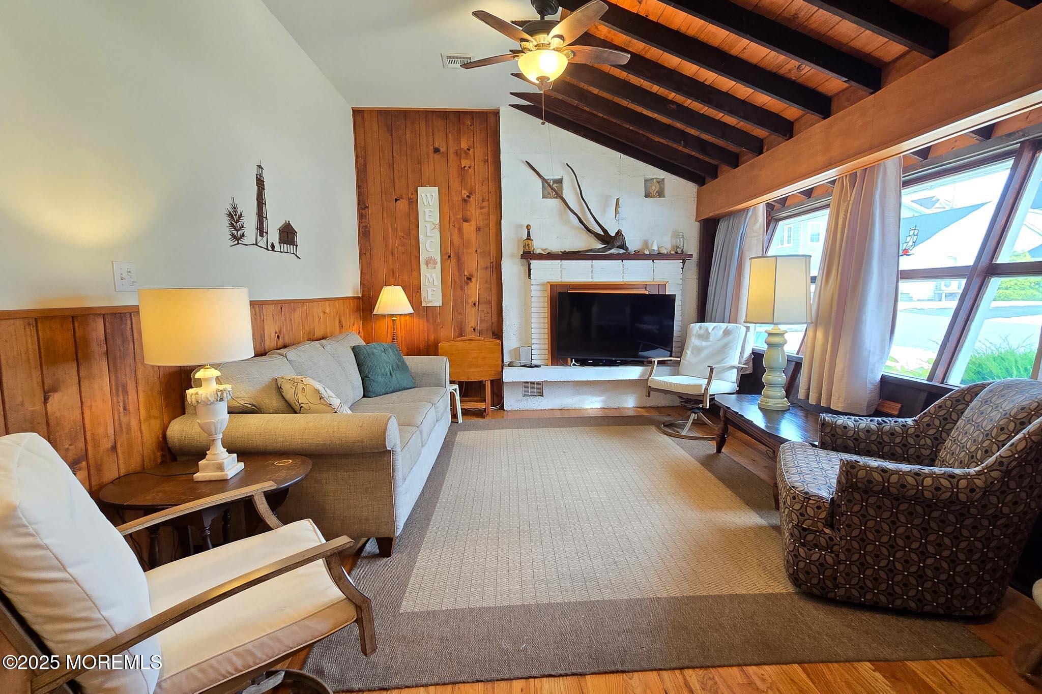 34 South Surf Road Lavallette, NJ 08735 - Photo 14 of 63 a living room with furniture and a fireplace