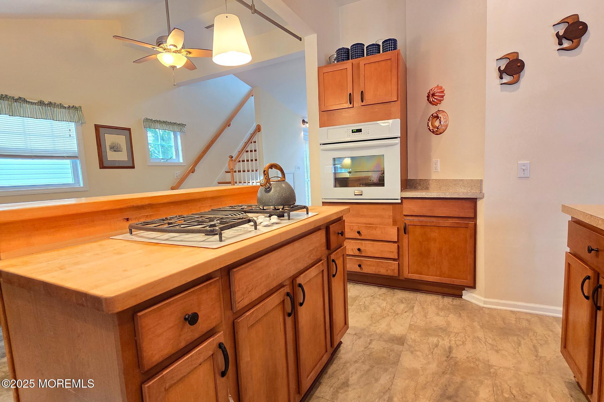 34 South Surf Road Lavallette, NJ 08735 - Photo 19 of 63 a kitchen with stainless steel appliances granite countertop a stove and a refrigerator