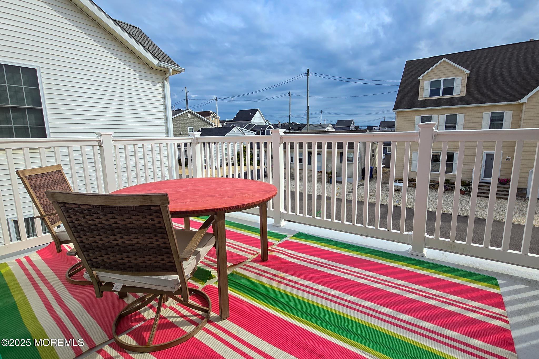 34 South Surf Road Lavallette, NJ 08735 - Photo 40 of 63 a view of a chairs and table on the deck