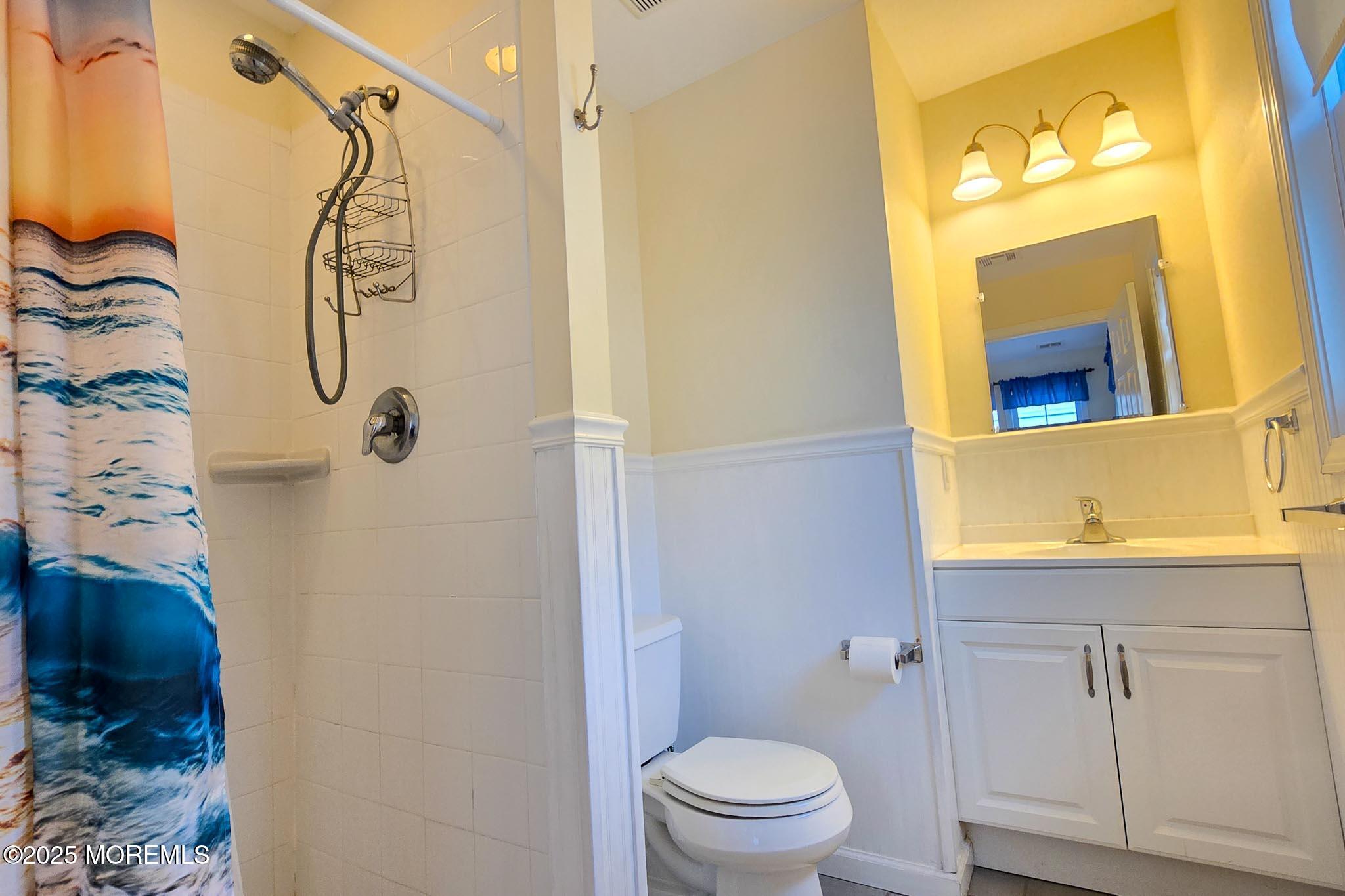 34 South Surf Road Lavallette, NJ 08735 - Photo 46 of 63 a bathroom with a shower a toilet and a sink