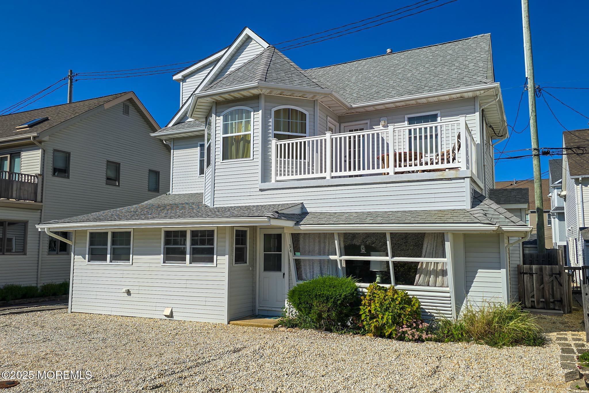 34 South Surf Road Lavallette, NJ 08735 - Photo 51 of 63 a front view of a house with a yard