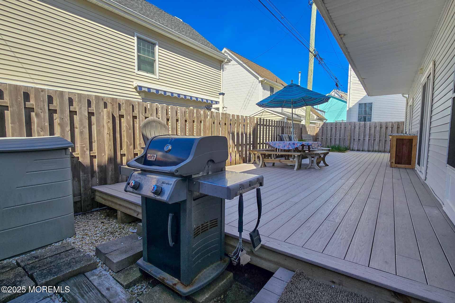 34 South Surf Road Lavallette, NJ 08735 - Photo 10 of 63 a view of a house with a chairs and table in a patio