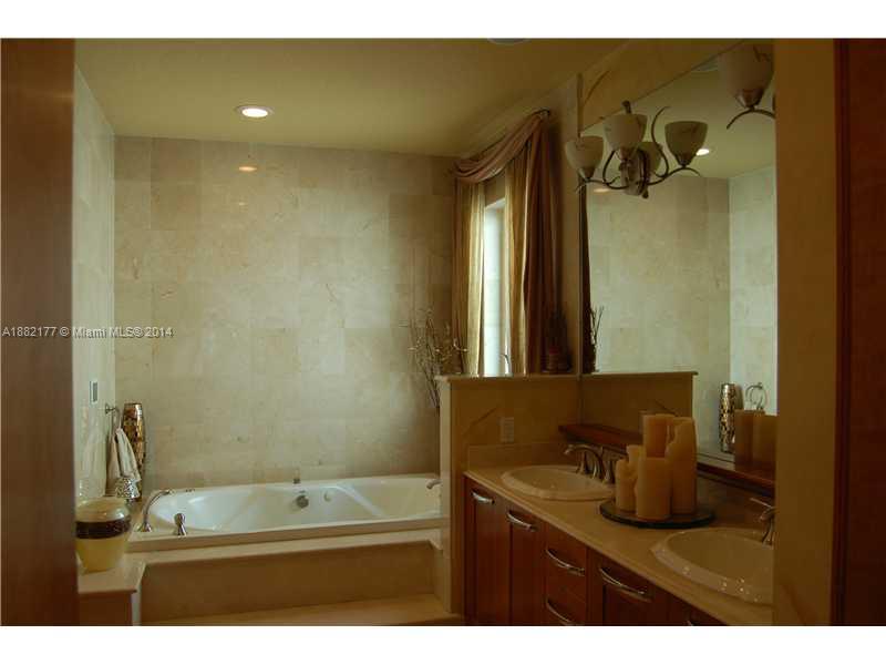 735 Southwest 22nd Road Miami, FL 33129 - Photo 12 of 14 a bathroom with a sink and a mirror