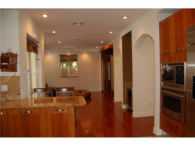 735 Southwest 22nd Road Miami, FL 33129 - Photo 4 of 14 a bathroom with a sink two mirror and a shower