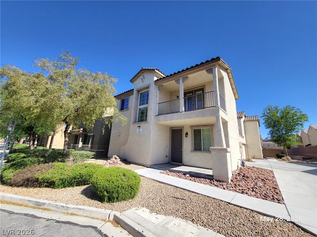 9843 West Overlook Ridge Avenue Las Vegas, NV 89148 - Photo 1 of 19 A charming two-story facade with an inviting second-floor balcony awaits.