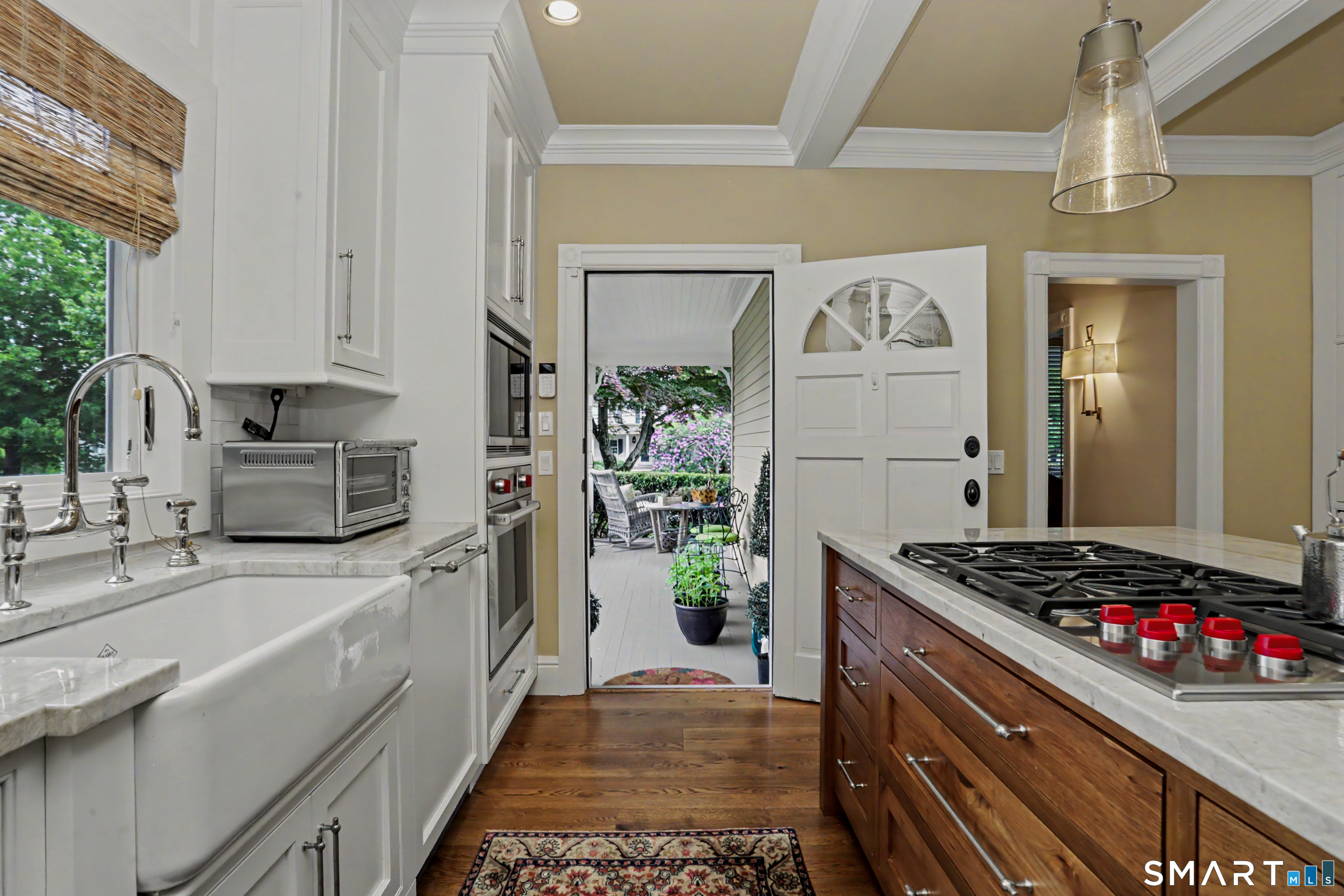 36 Catoonah Street, Unit 18 Ridgefield, CT 06877 - Photo 14 of 40 a kitchen with stainless steel appliances granite countertop a sink stove and refrigerator