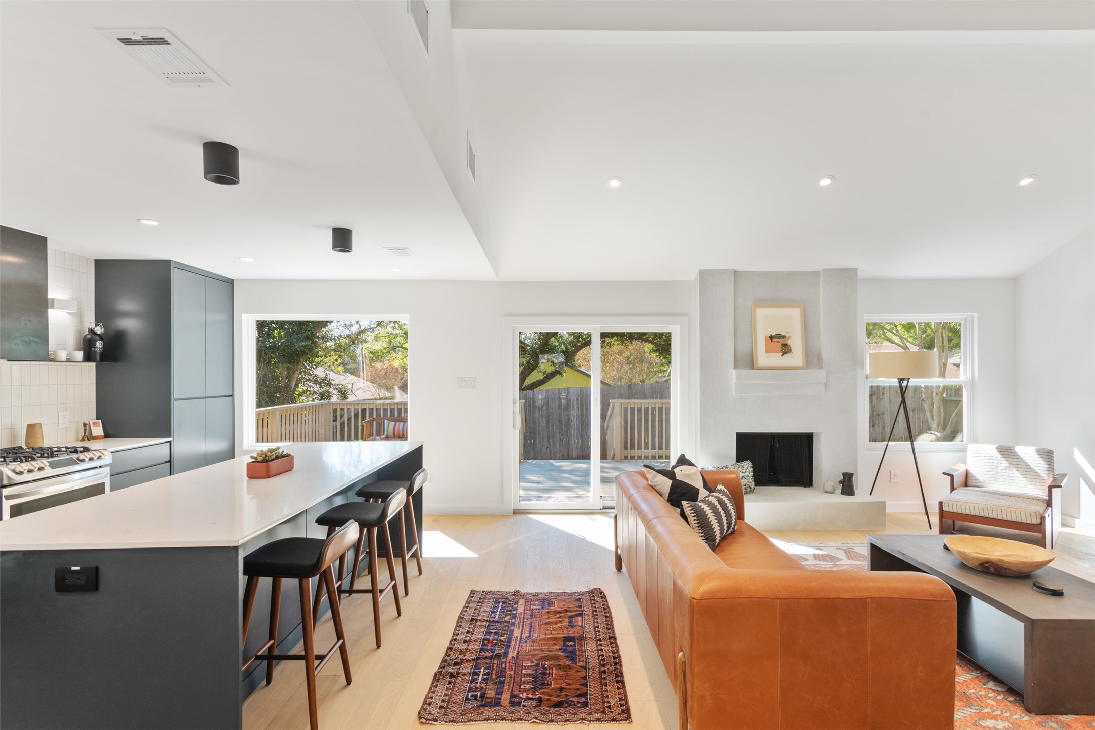2815 Goldbridge Drive Austin, TX 78745 - Photo 12 of 40 Living room with light wood-type flooring, recessed lighting, and a large fireplace