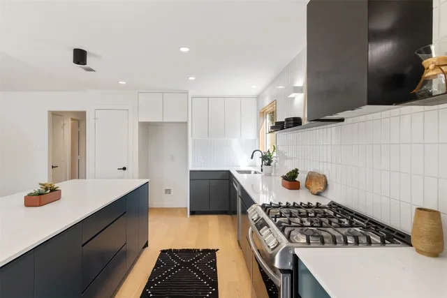 a kitchen with a stove and a refrigerator