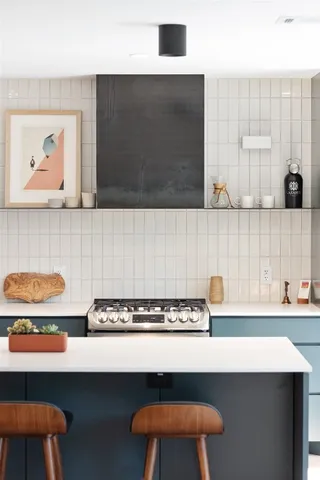 a view of room with cabinets and wooden floor