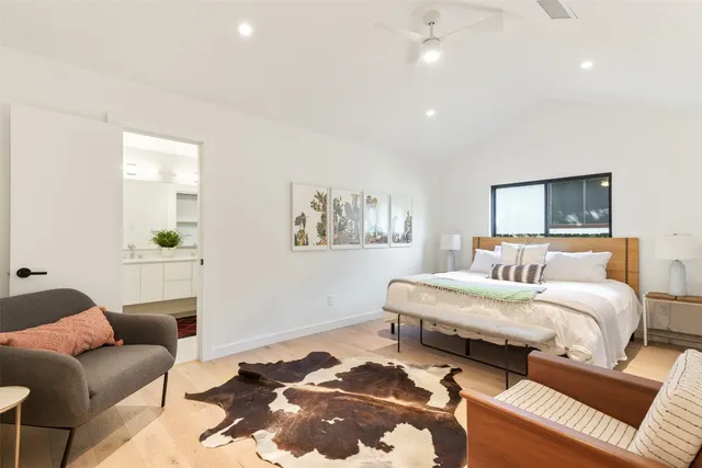 a bedroom with a bed and couch