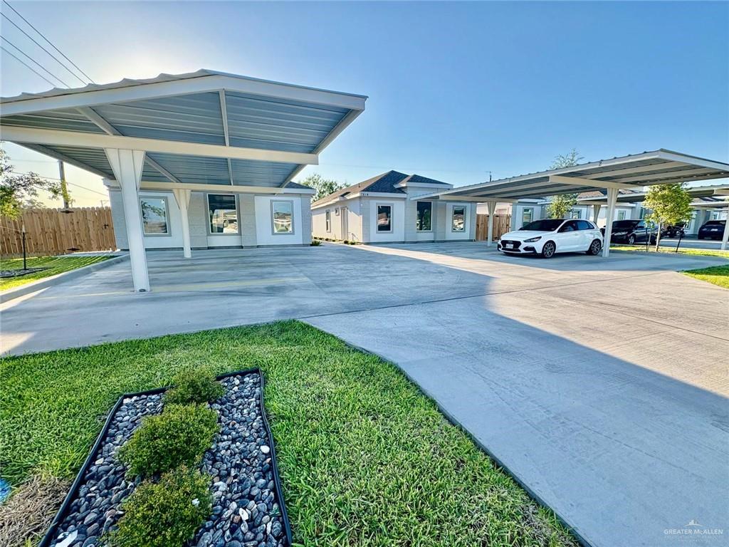 7814 North 58th Street, Unit 3 Mission, TX 78573 - Photo 2 of 11 a front view of a house with a garden