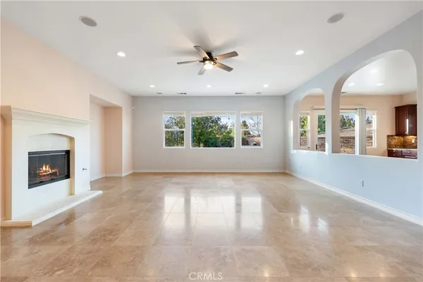 a large kitchen with a large counter top appliances and cabinets