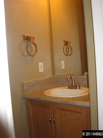 1470 Rainbow Ridge Road Reno, NV 89523 - Photo 7 of 13 a bathroom with a sink and a mirror