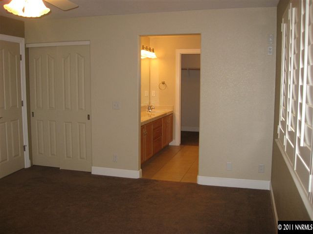 1470 Rainbow Ridge Road Reno, NV 89523 - Photo 9 of 13 a view of an empty room with a window
