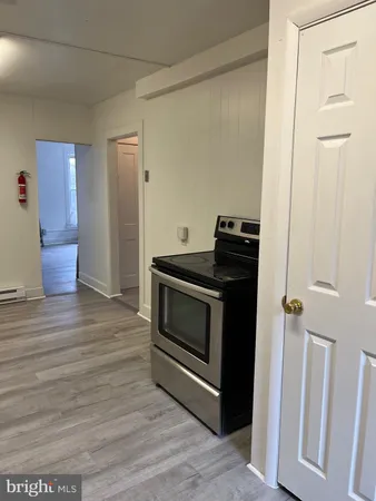 a kitchen with a stove and a refrigerator
