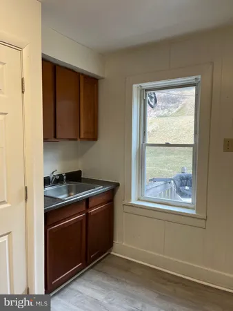 a kitchen with stainless steel appliances granite countertop a stove and a microwave
