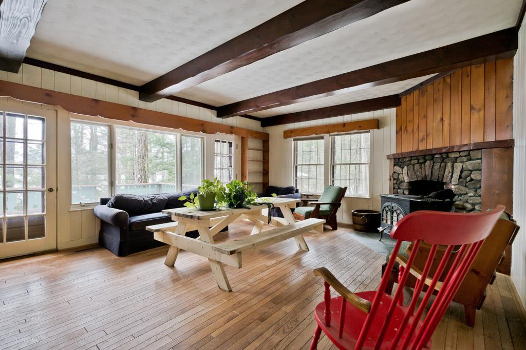 76 Severance Lodge Road Lovell, ME 04051 - Photo 8 of 33 Classic living room with wood stove...