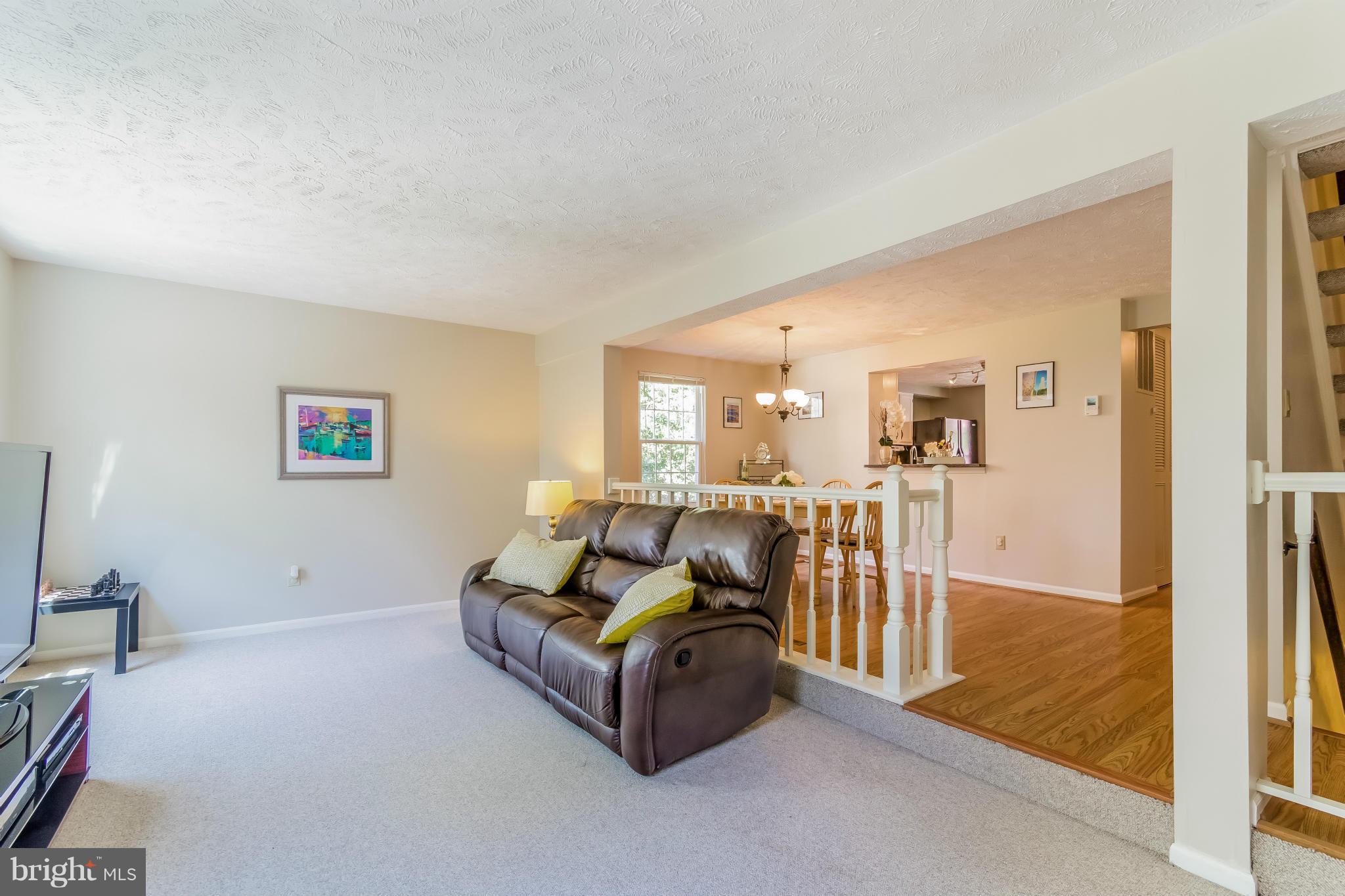 1547 Autumn Ridge Circle Reston, VA 20194 - Photo 12 of 30 a living room with furniture and a table
