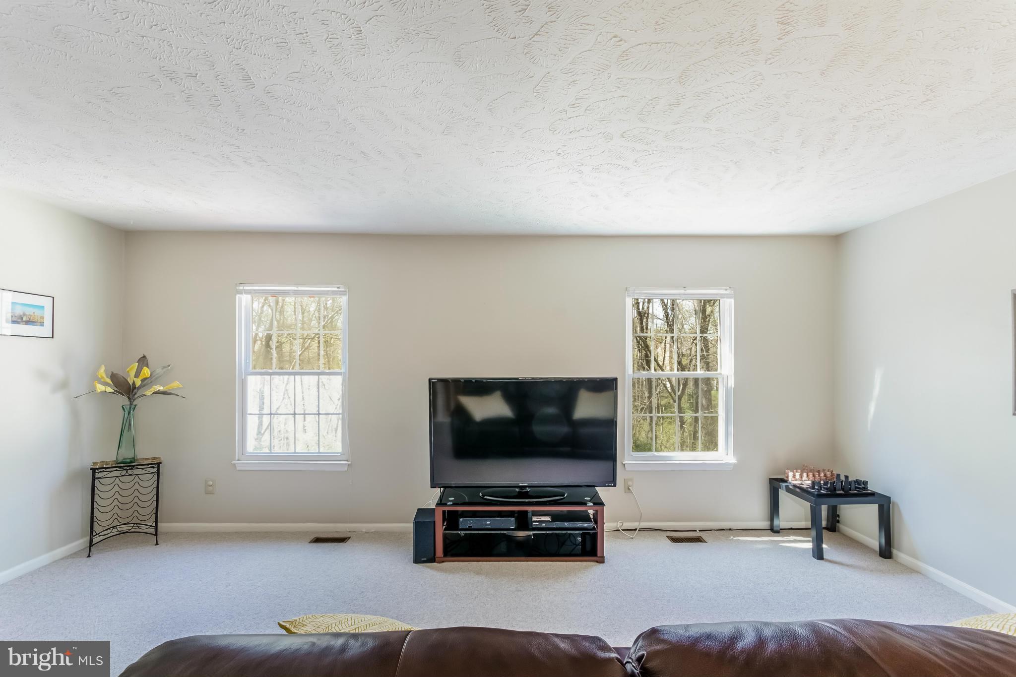1547 Autumn Ridge Circle Reston, VA 20194 - Photo 15 of 30 a living room with furniture and a flat screen tv