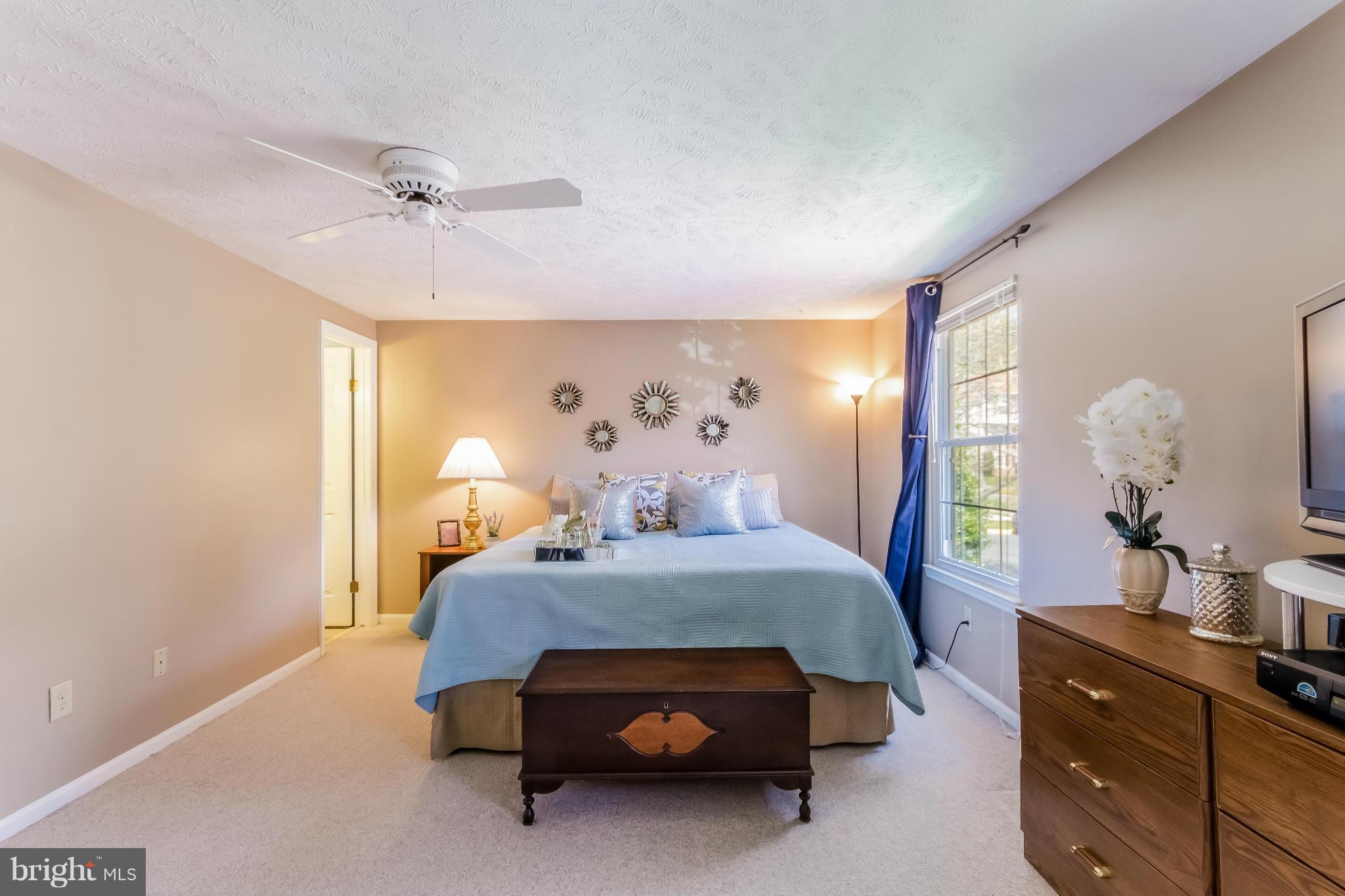 1547 Autumn Ridge Circle Reston, VA 20194 - Photo 17 of 30 a bedroom with a bed and a dresser