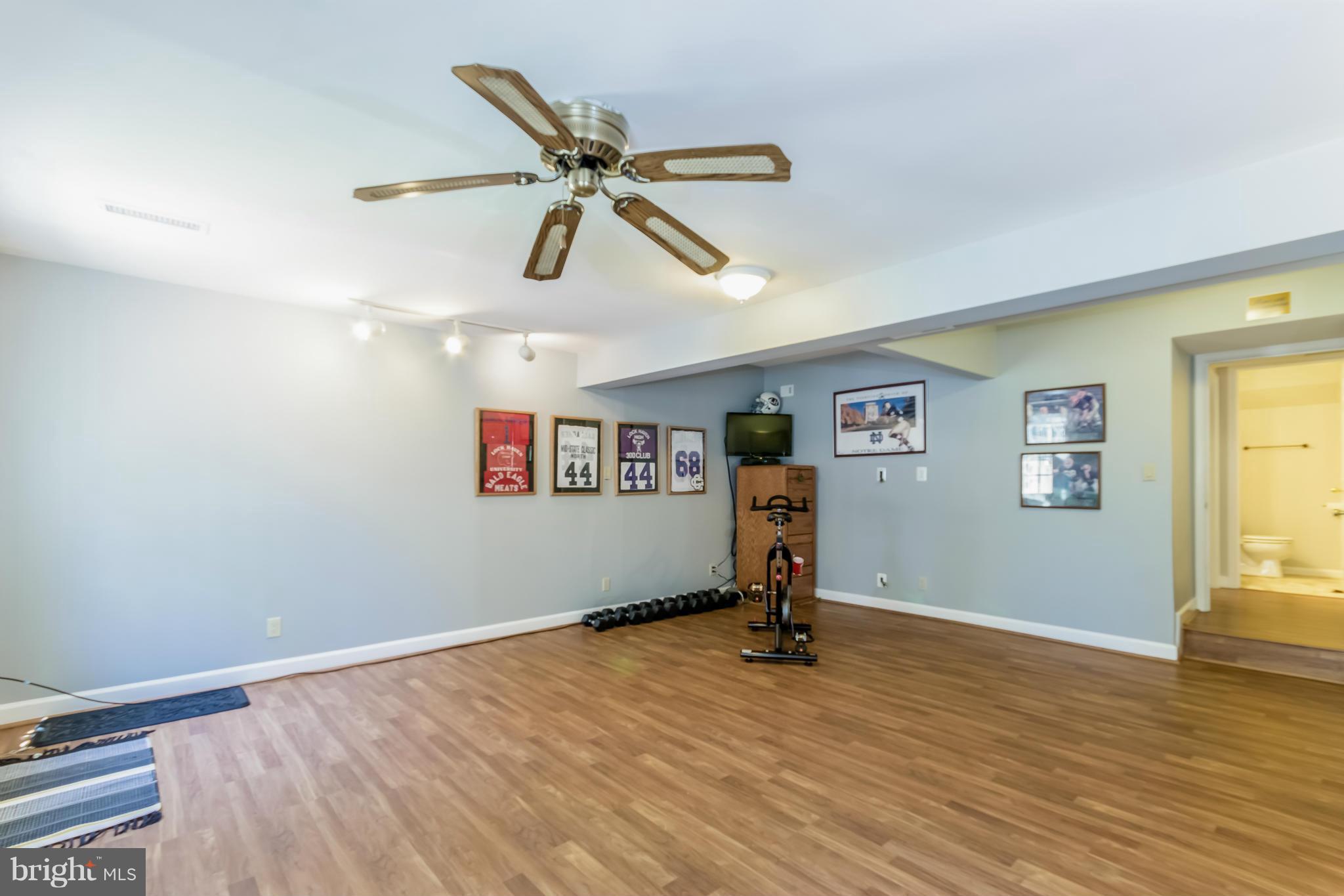 1547 Autumn Ridge Circle Reston, VA 20194 - Photo 24 of 30 a view of a room with wooden floor and windows