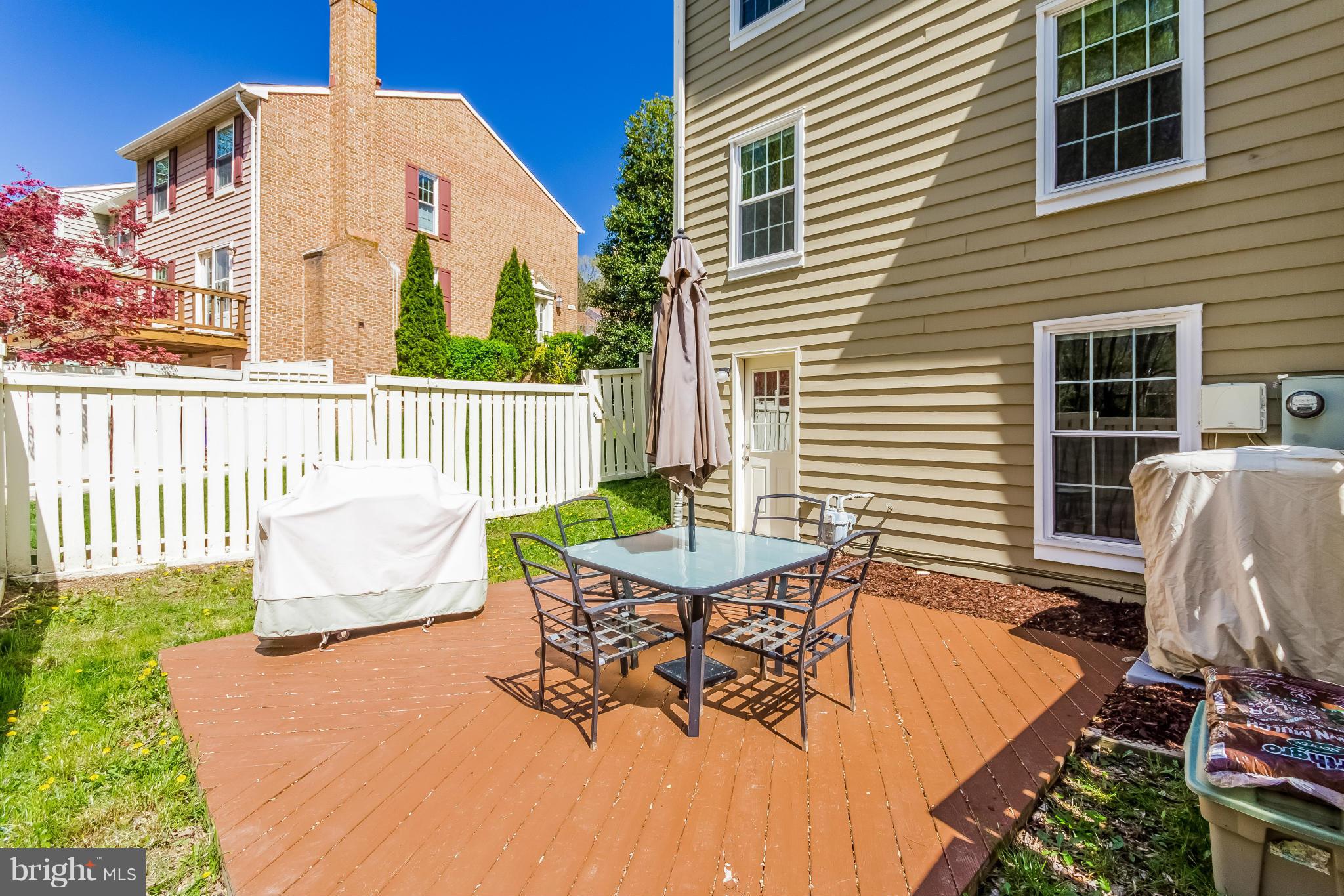 1547 Autumn Ridge Circle Reston, VA 20194 - Photo 27 of 30 a view of a patio with couches table and chairs and potted plants