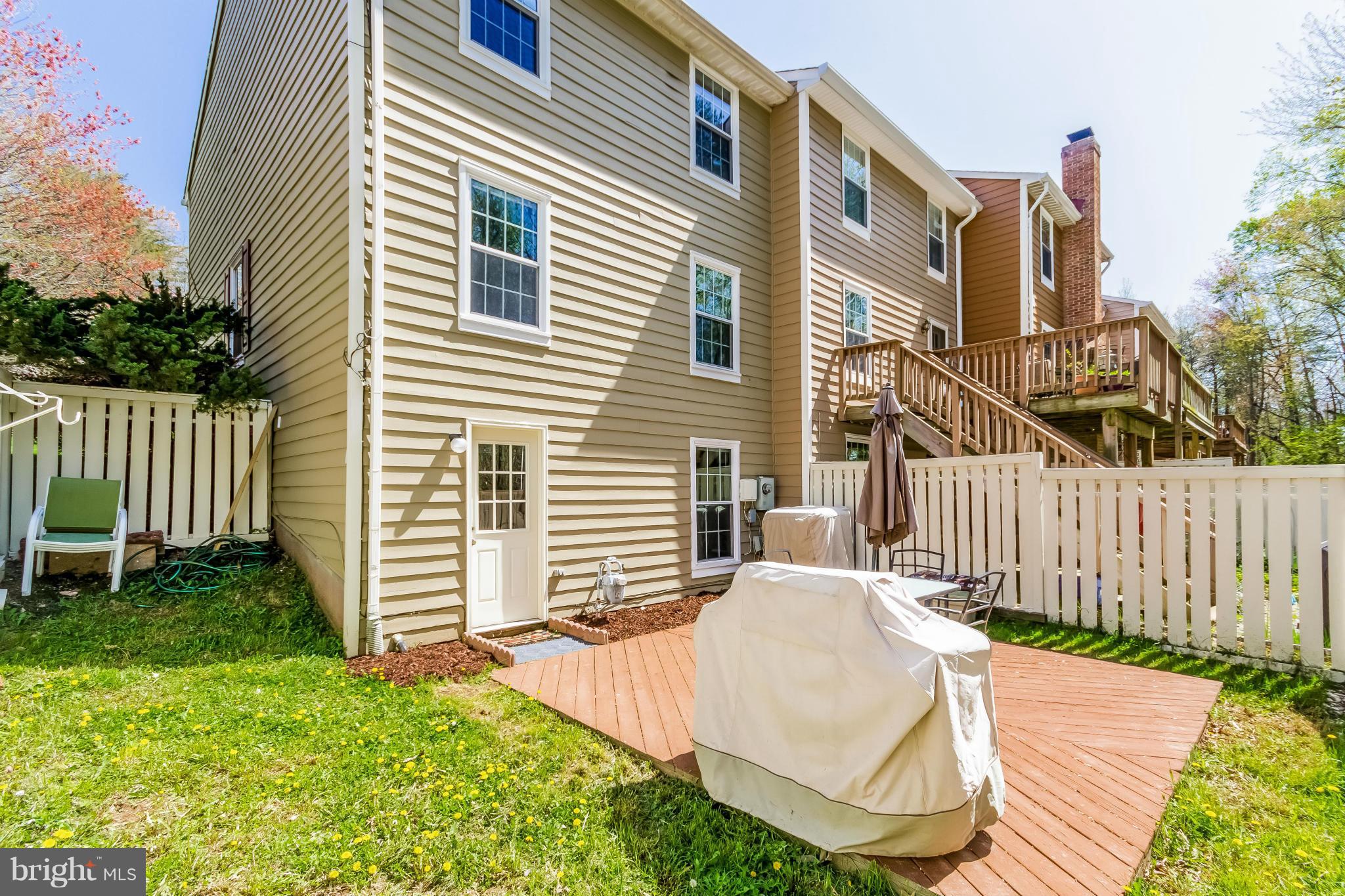 1547 Autumn Ridge Circle Reston, VA 20194 - Photo 28 of 30 a view of backyard with barbeque grill and wooden fence