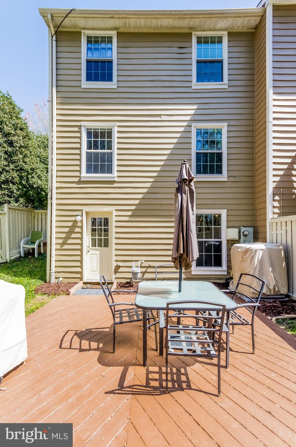 1547 Autumn Ridge Circle Reston, VA 20194 - Photo 29 of 30 a view of backyard with seating space and wooden fence