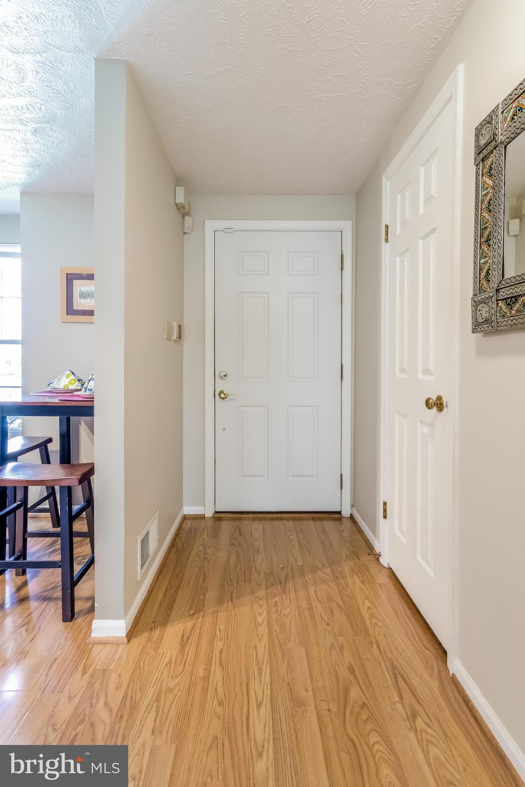 1547 Autumn Ridge Circle Reston, VA 20194 - Photo 3 of 30 a view of a livingroom with wooden floor and furniture