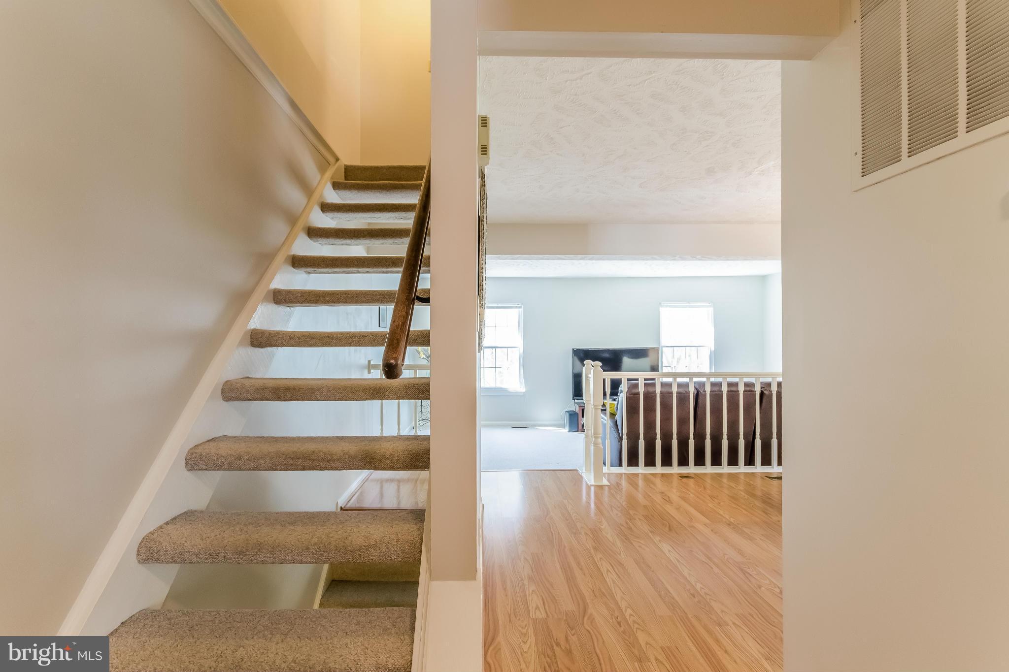 1547 Autumn Ridge Circle Reston, VA 20194 - Photo 4 of 30 a view of staircase with white walls and a window