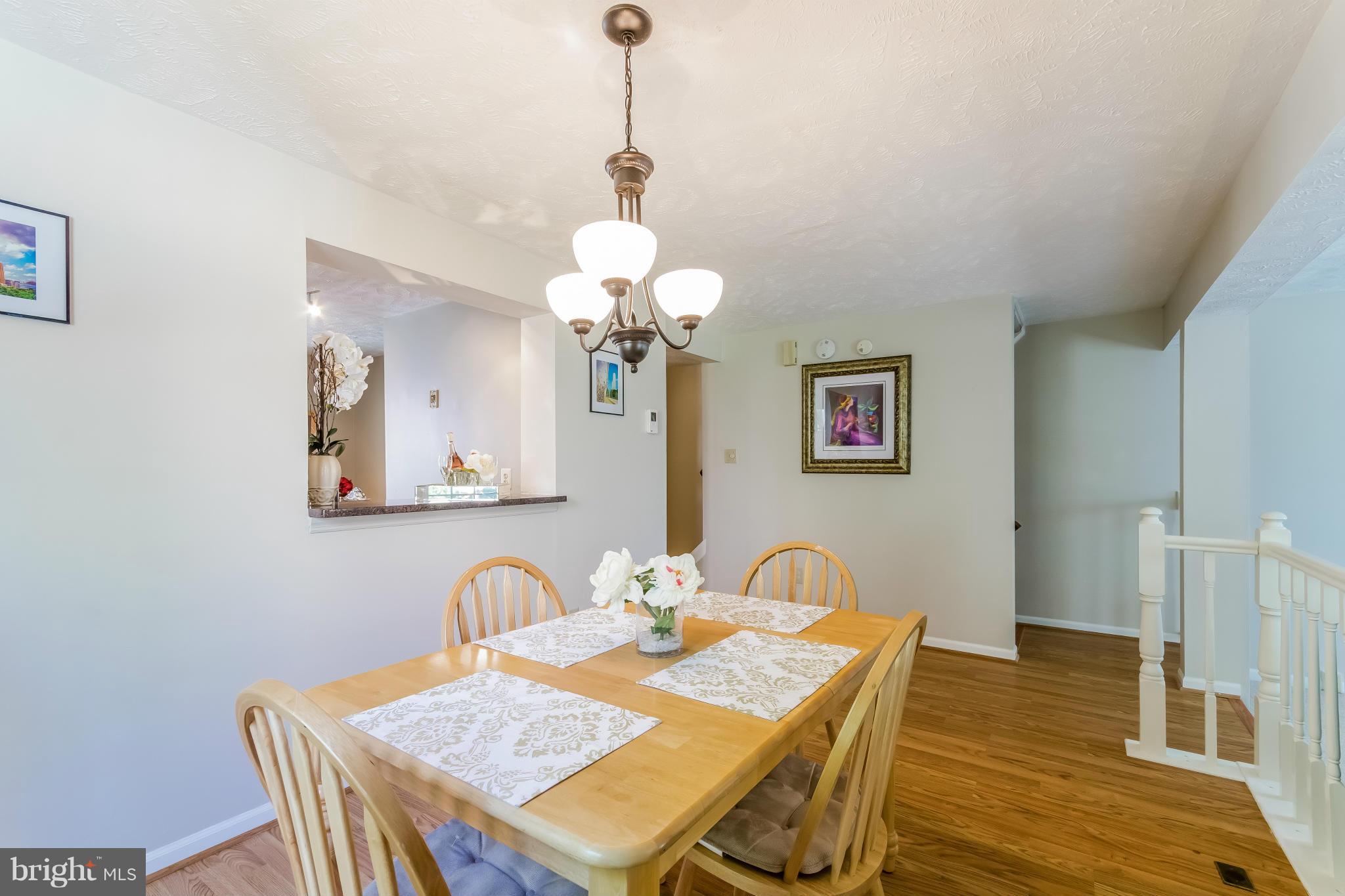 1547 Autumn Ridge Circle Reston, VA 20194 - Photo 10 of 30 a dining room with furniture and wooden floor