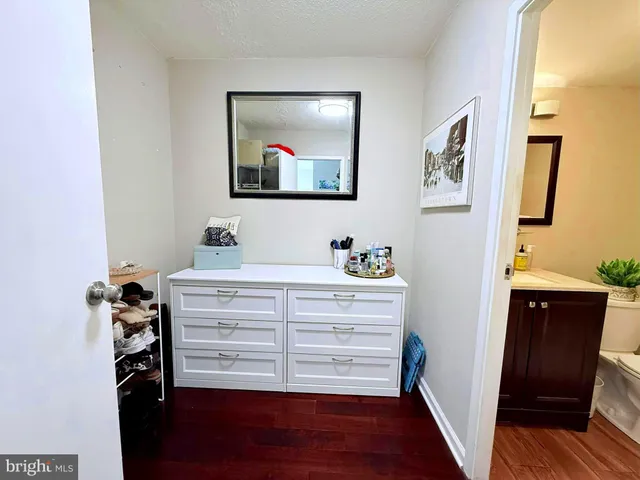 a bedroom with a bed and a cabinets