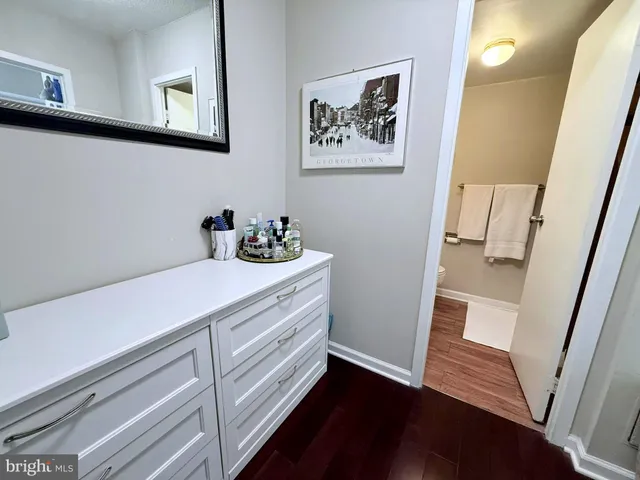 a bathroom with a sink toilet a mirror and vanity