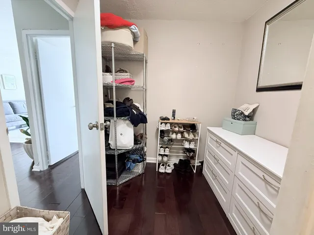 a bedroom with a large bed and a large window