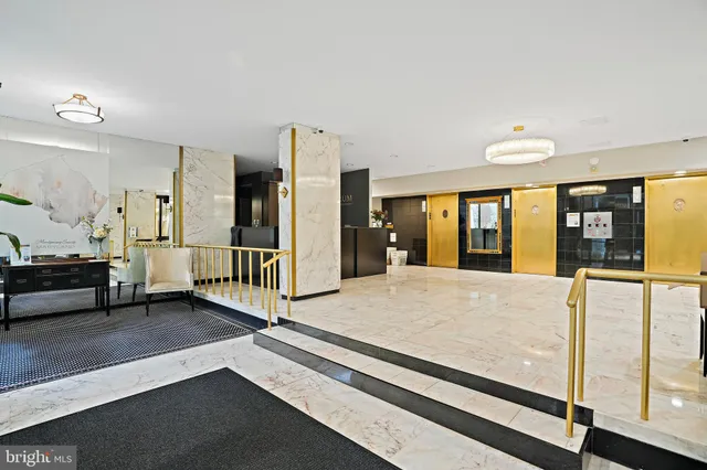 a living room with patio furniture and a large window