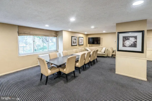 a view of a swimming pool with a patio and a garden