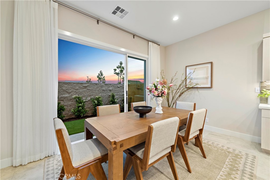 220 Burwood Lake Forest, CA 92630 - Photo 11 of 25 a view of a dining room with furniture window and wooden floor