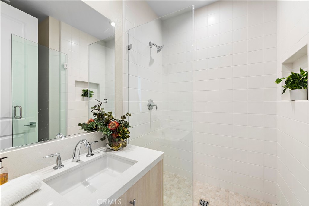 220 Burwood Lake Forest, CA 92630 - Photo 12 of 25 a bathroom with a sink shower and a mirror