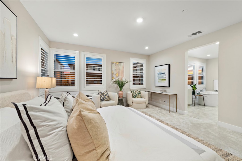220 Burwood Lake Forest, CA 92630 - Photo 16 of 25 a spacious bedroom with a large bed and furniture