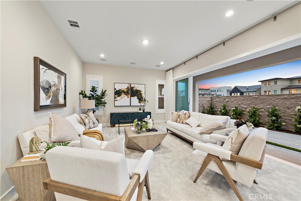220 Burwood Lake Forest, CA 92630 - Photo 5 of 25 a living room with furniture and a large window
