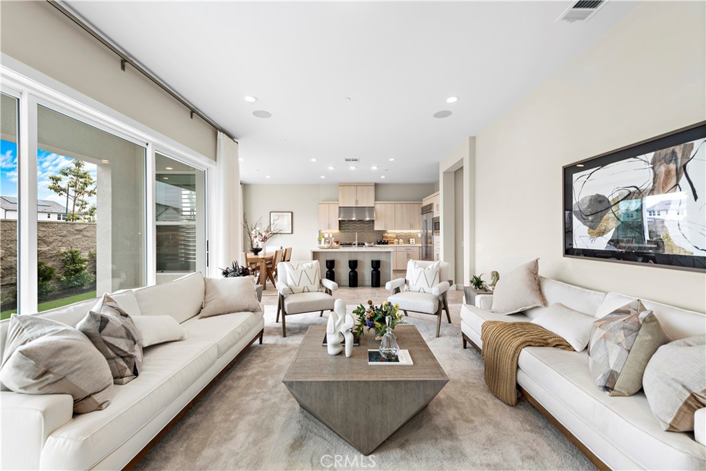 220 Burwood Lake Forest, CA 92630 - Photo 7 of 25 a living room with furniture or couch and a large window