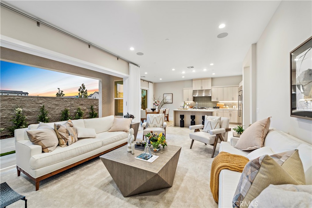 220 Burwood Lake Forest, CA 92630 - Photo 8 of 25 a living room with furniture kitchen view and a large window