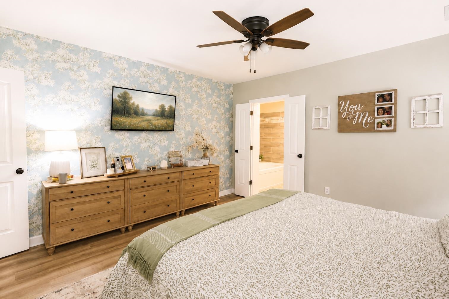 10093 Mt Carmel Road Brighton, TN 38011 - Photo 24 of 36 Spacious room featuring wood-finish flooring and a light blue floral accent wall