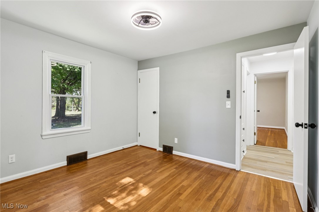 5898 Keller Road Akron, OH 44319 - Photo 12 of 32 Unfurnished bedroom with light wood finished floors and baseboards