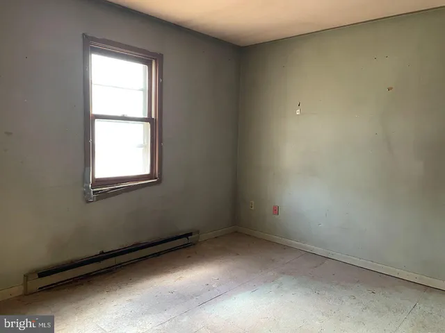 a bathroom with a toilet sink and a window